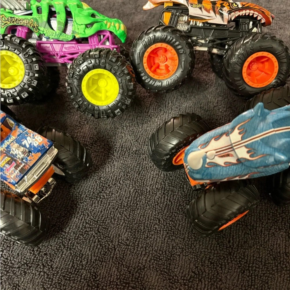 Hot Wheels 4 lot of Monster Truck Toys. Assorted Colors (Green, Orange, Blue)